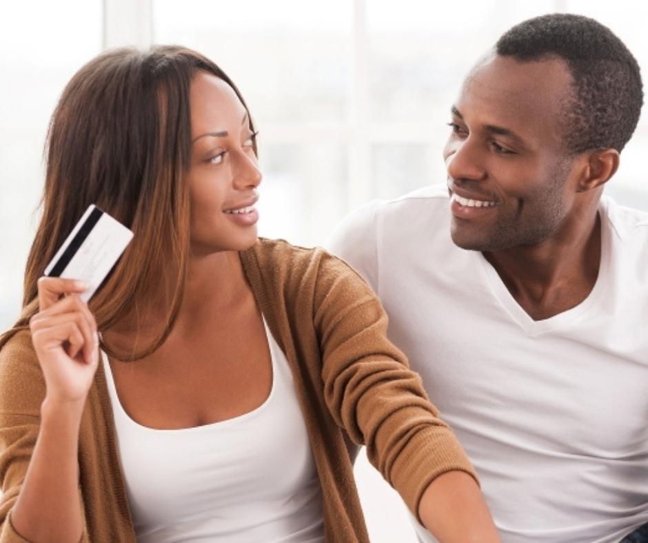 Couple using a BlueOx Platinum Rewards Credit Card.