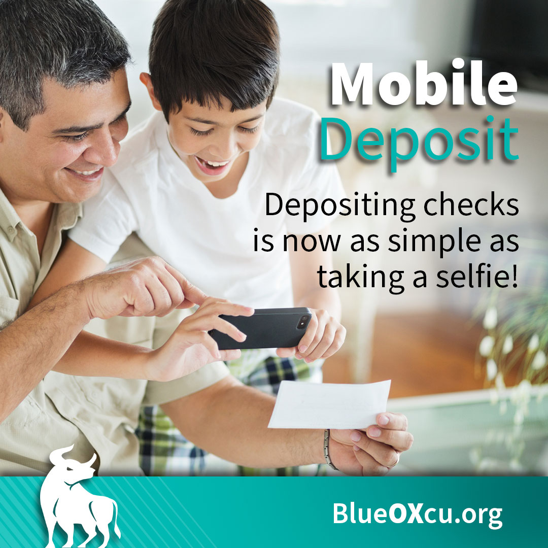 Mobile Deposit, father and son taking a photo of a check to deposit into their credit union account