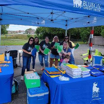 BlueOx staff hand out school supplies to the Battle Creek Community at our Back-To-School Bash!